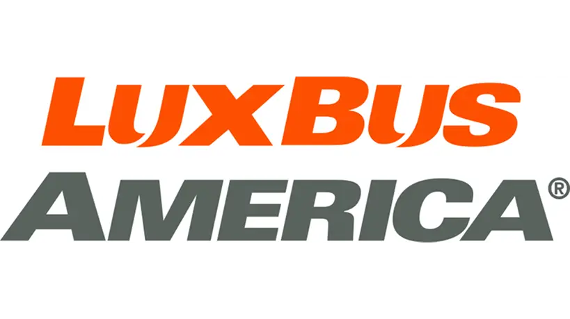 Lux Bus America logo featuring bold orange and gray text on a black background.